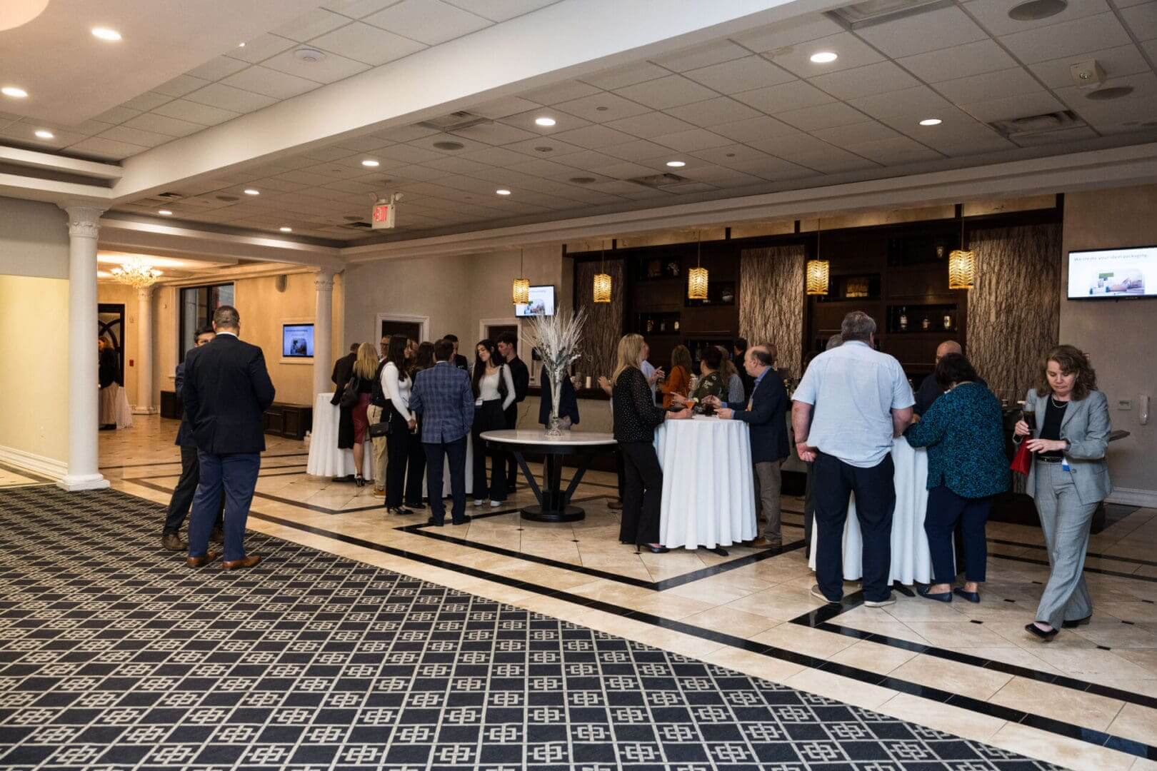 People gathering in a room for an event.