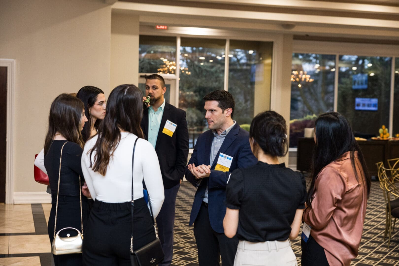 A group of people are networking at an event.