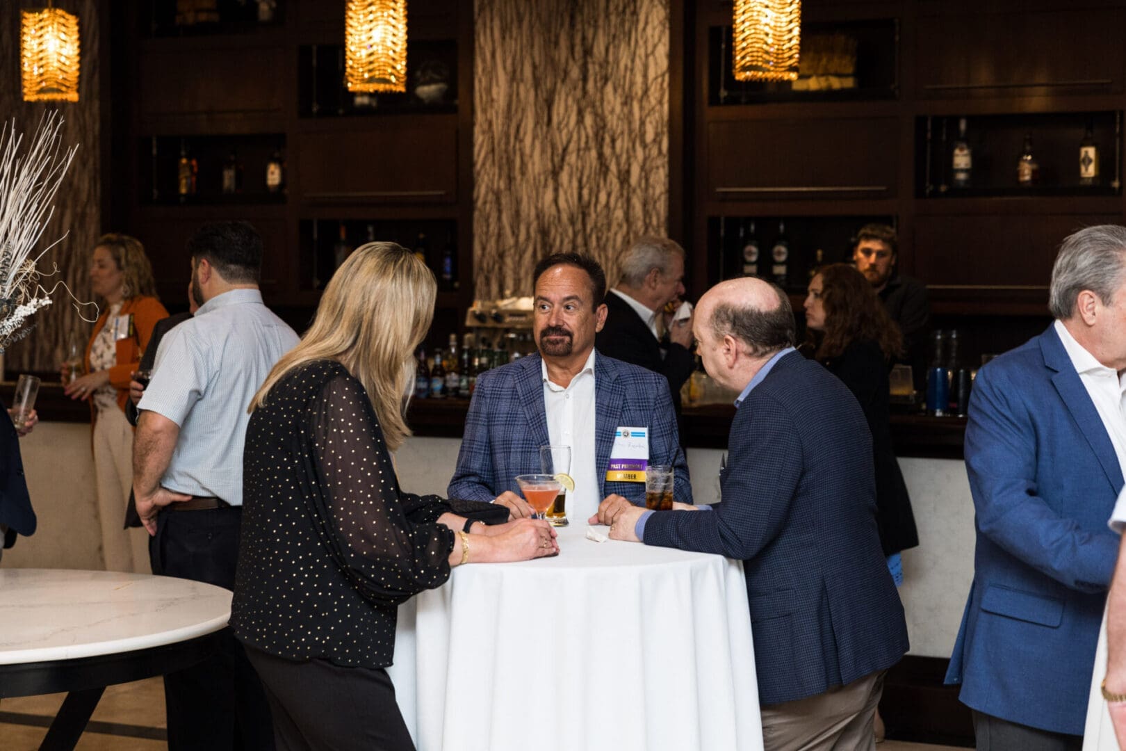 People talking at a networking event.