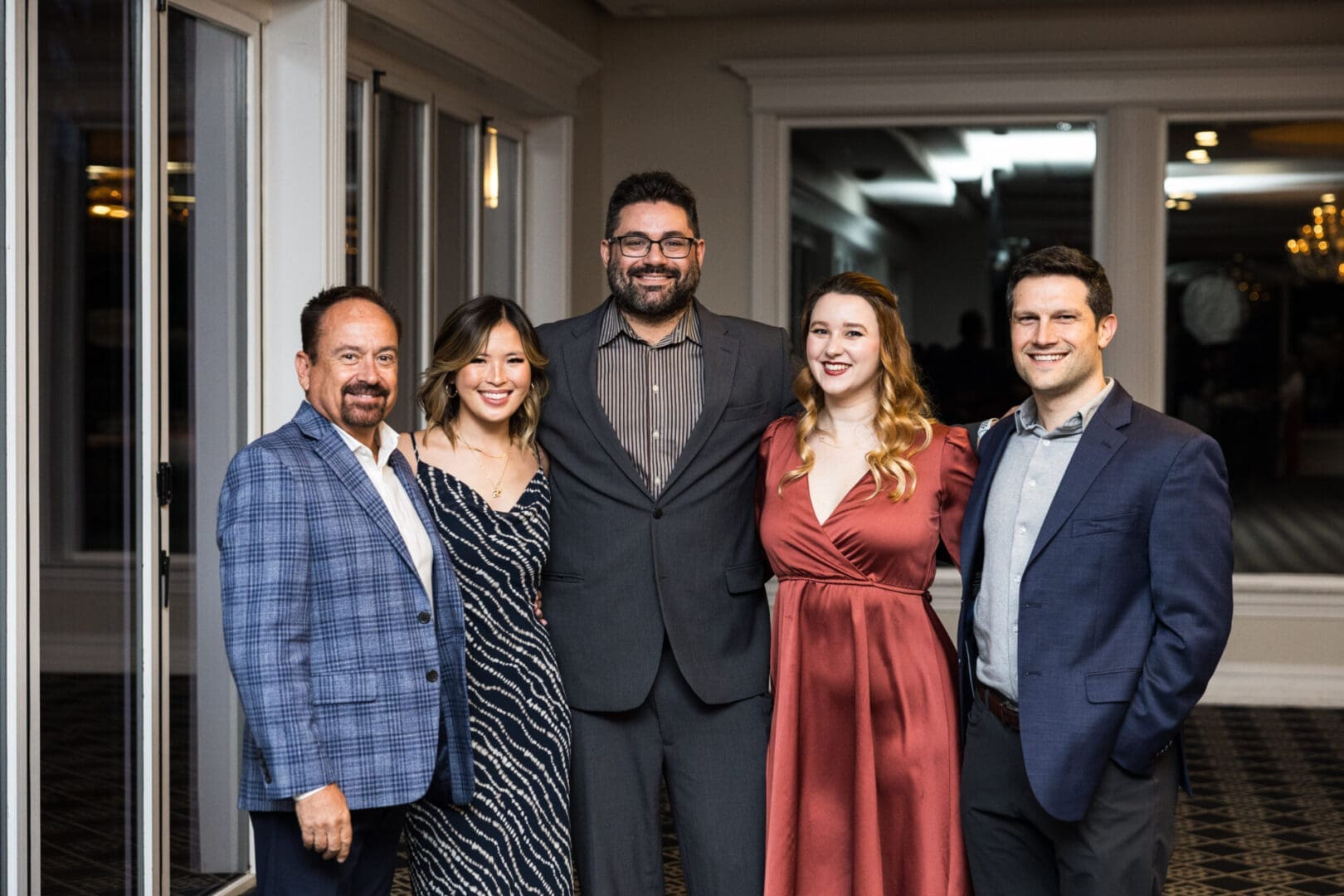 Group of people posing for a photo at an event.