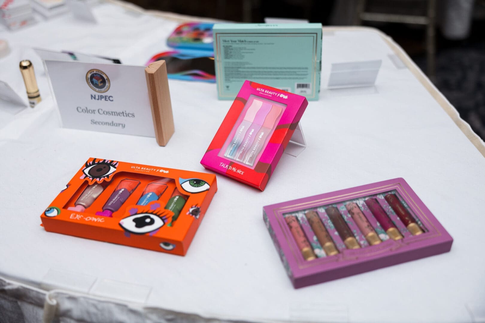 Color cosmetics showcased on a table.