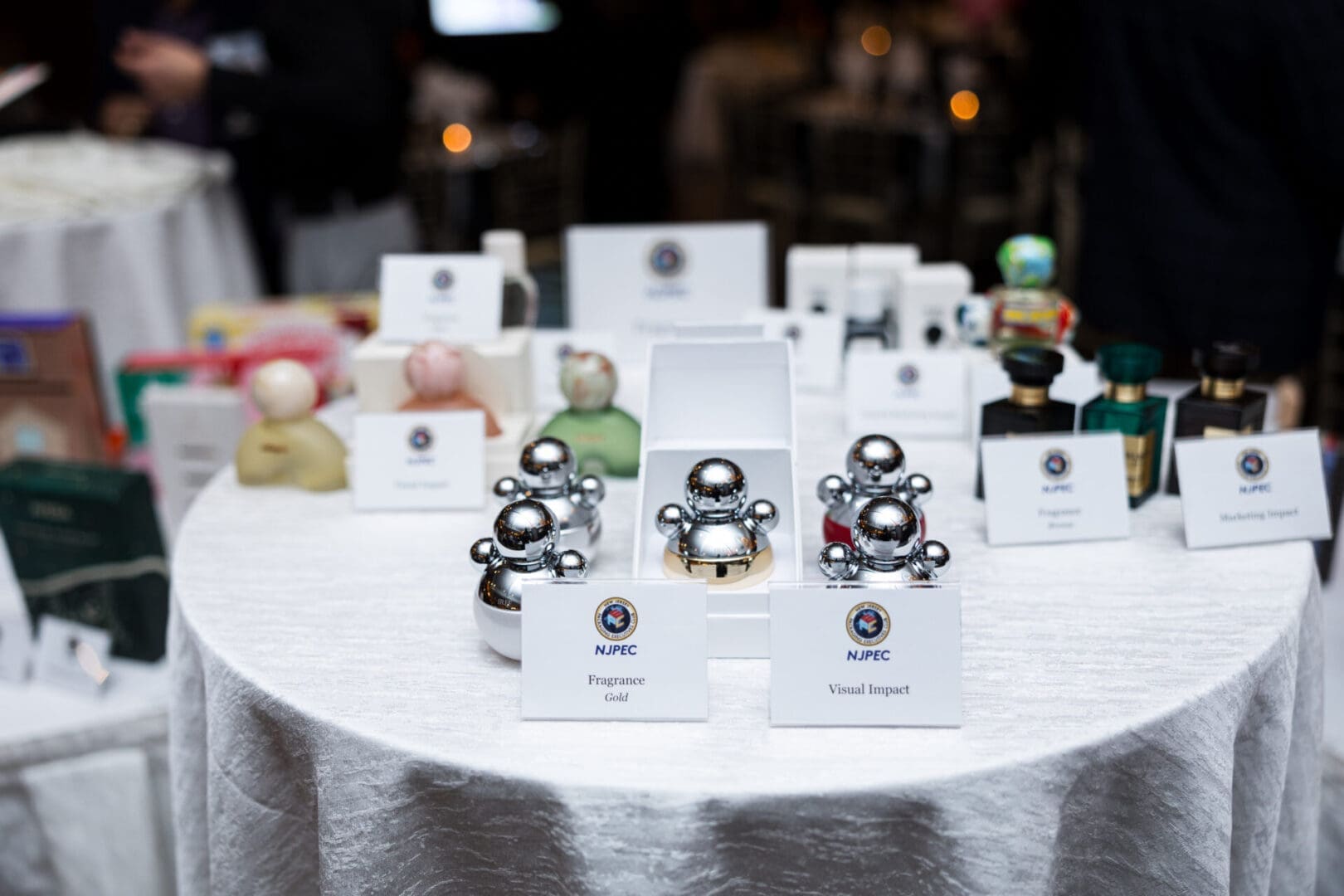 Various perfumes displayed on a table.