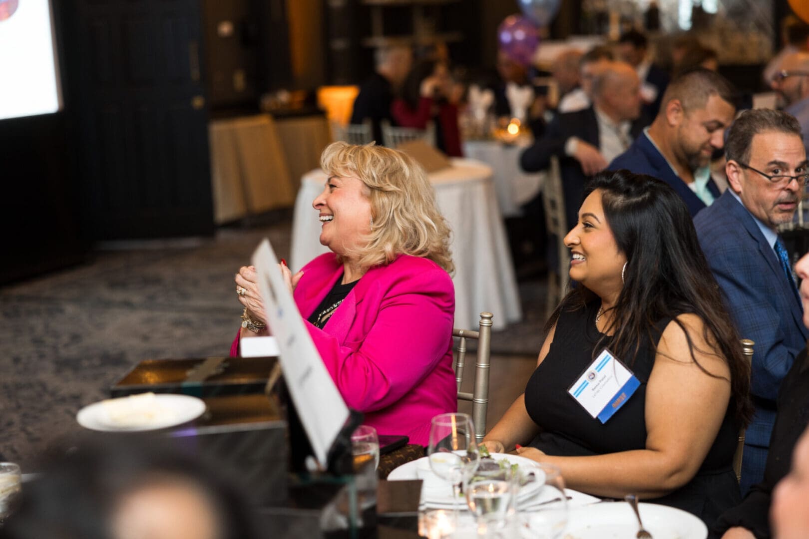 Smiling guests enjoying a lively event.