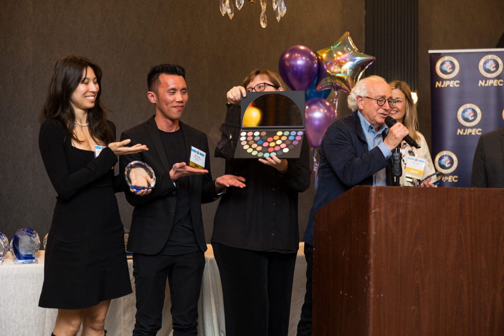 Group of people celebrating at event.