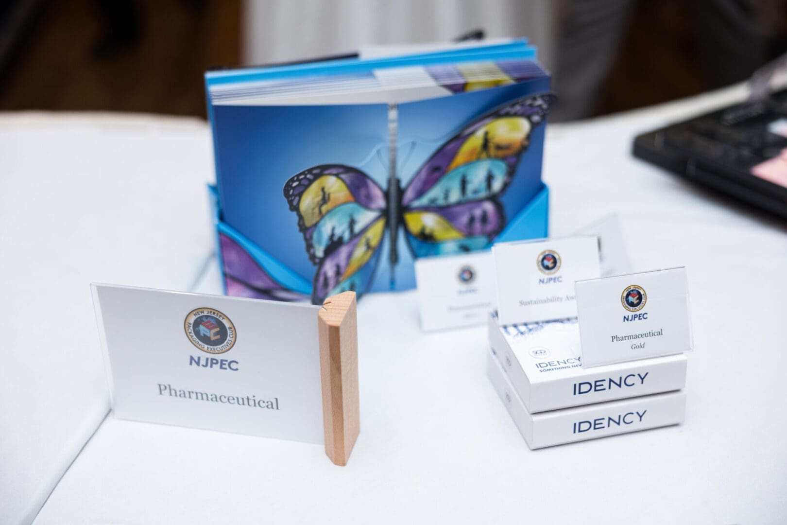 NJPEC promotional materials with butterfly design.