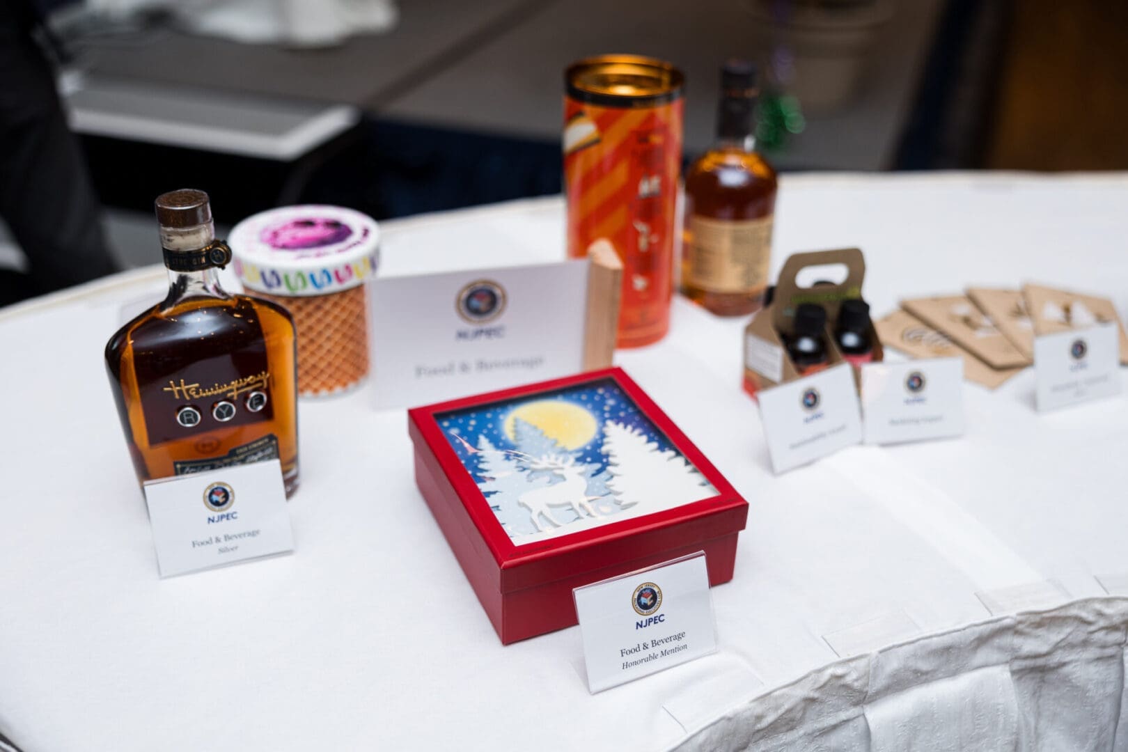 Bottles and gifts displayed on a table.
