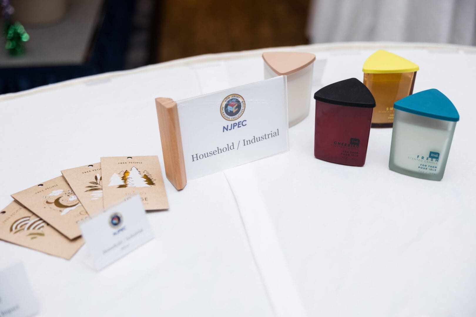 Candles and informational cards on table.