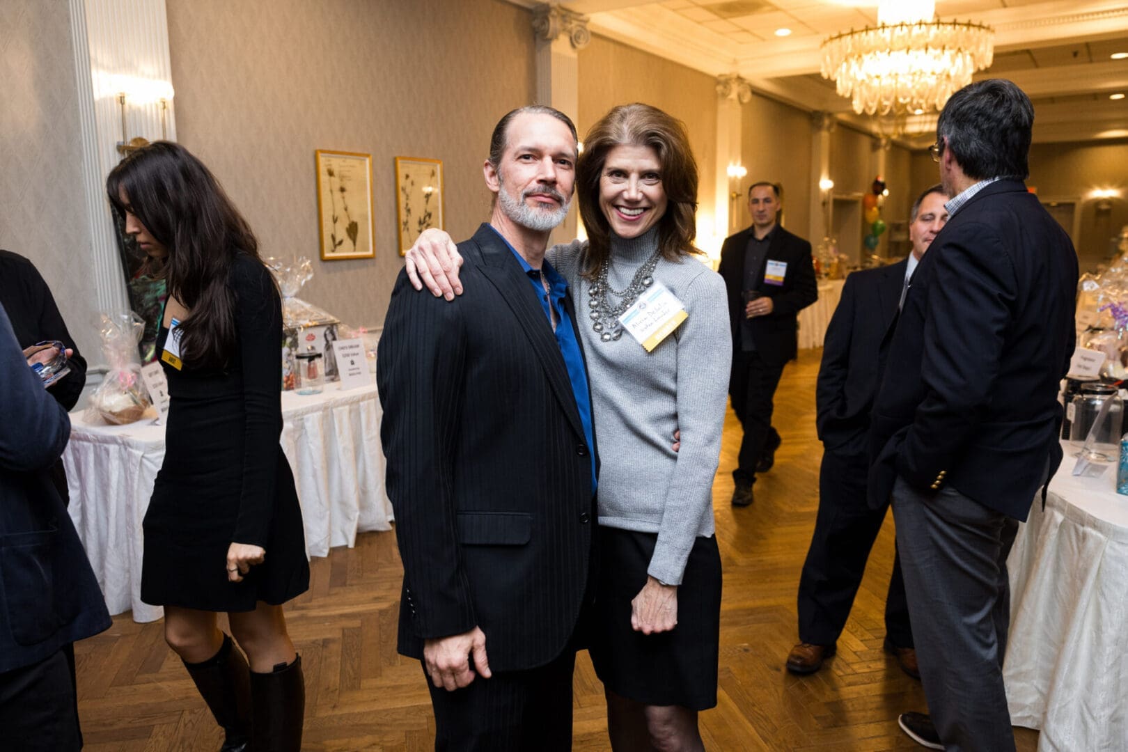 Couple posing at a social event.
