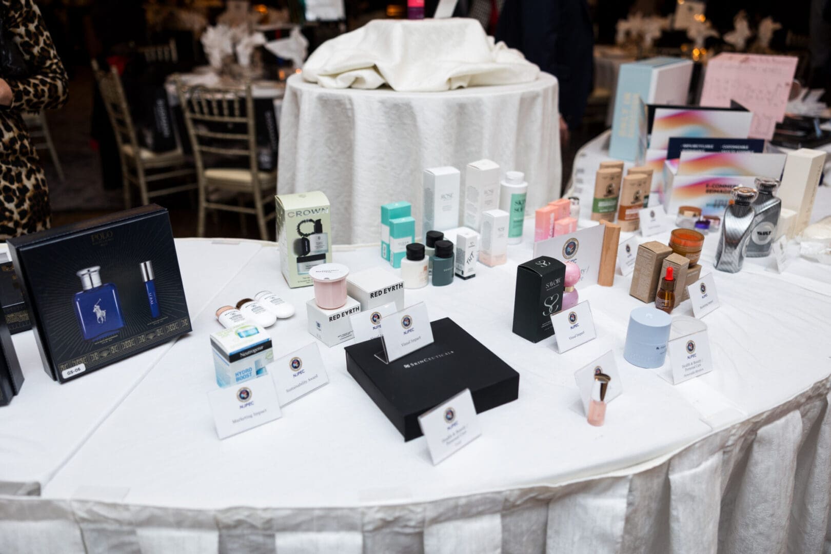Table displaying various beauty and fragrance products.