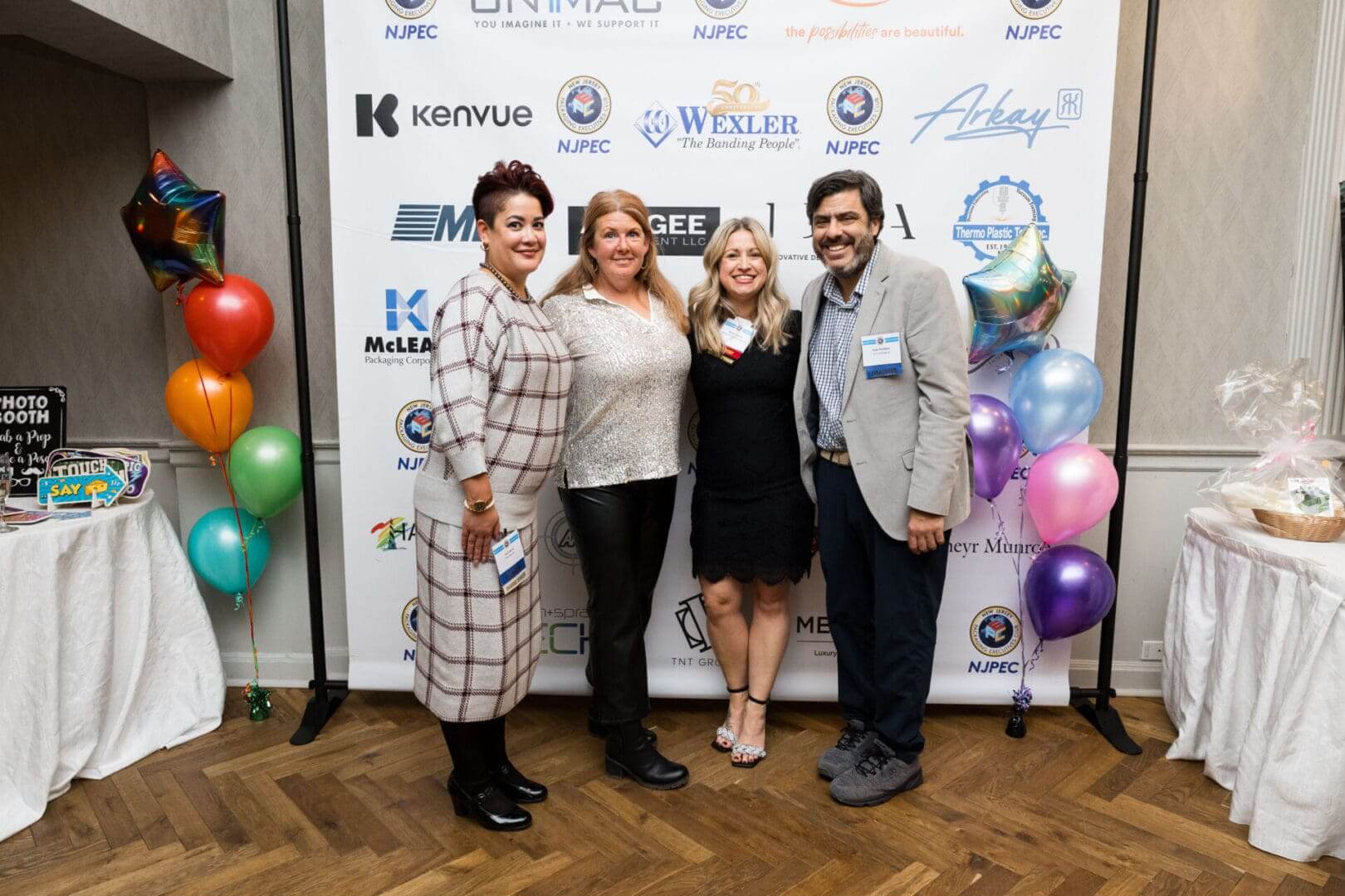 Group of four people at an event.
