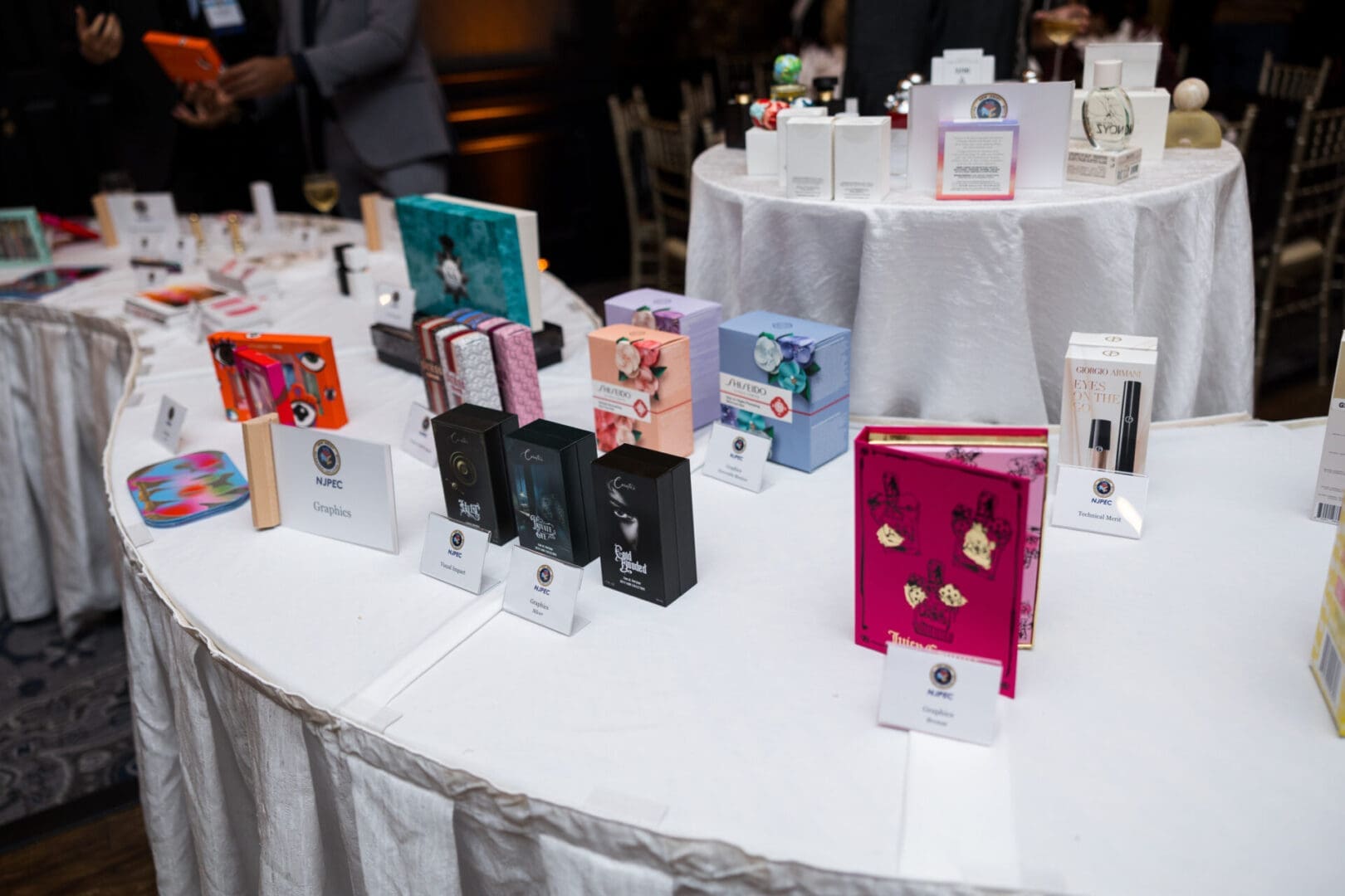 Display of colorful packaged products on tables.