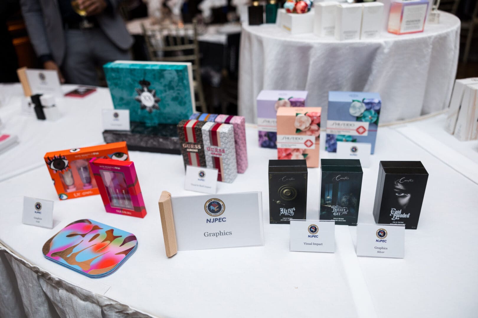 Display of colorful product packaging on table.