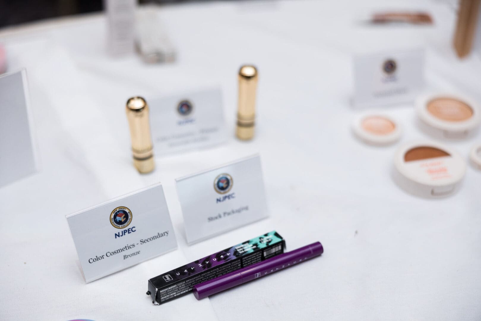 Cosmetics products displayed on a table.