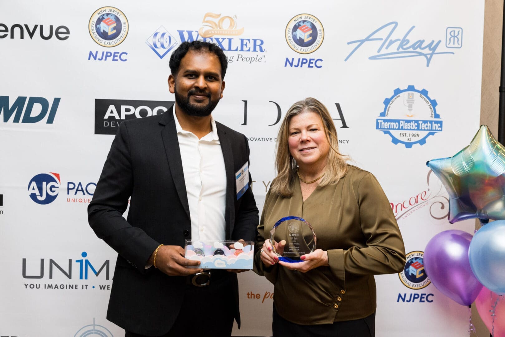Two award recipients posing for a photo.