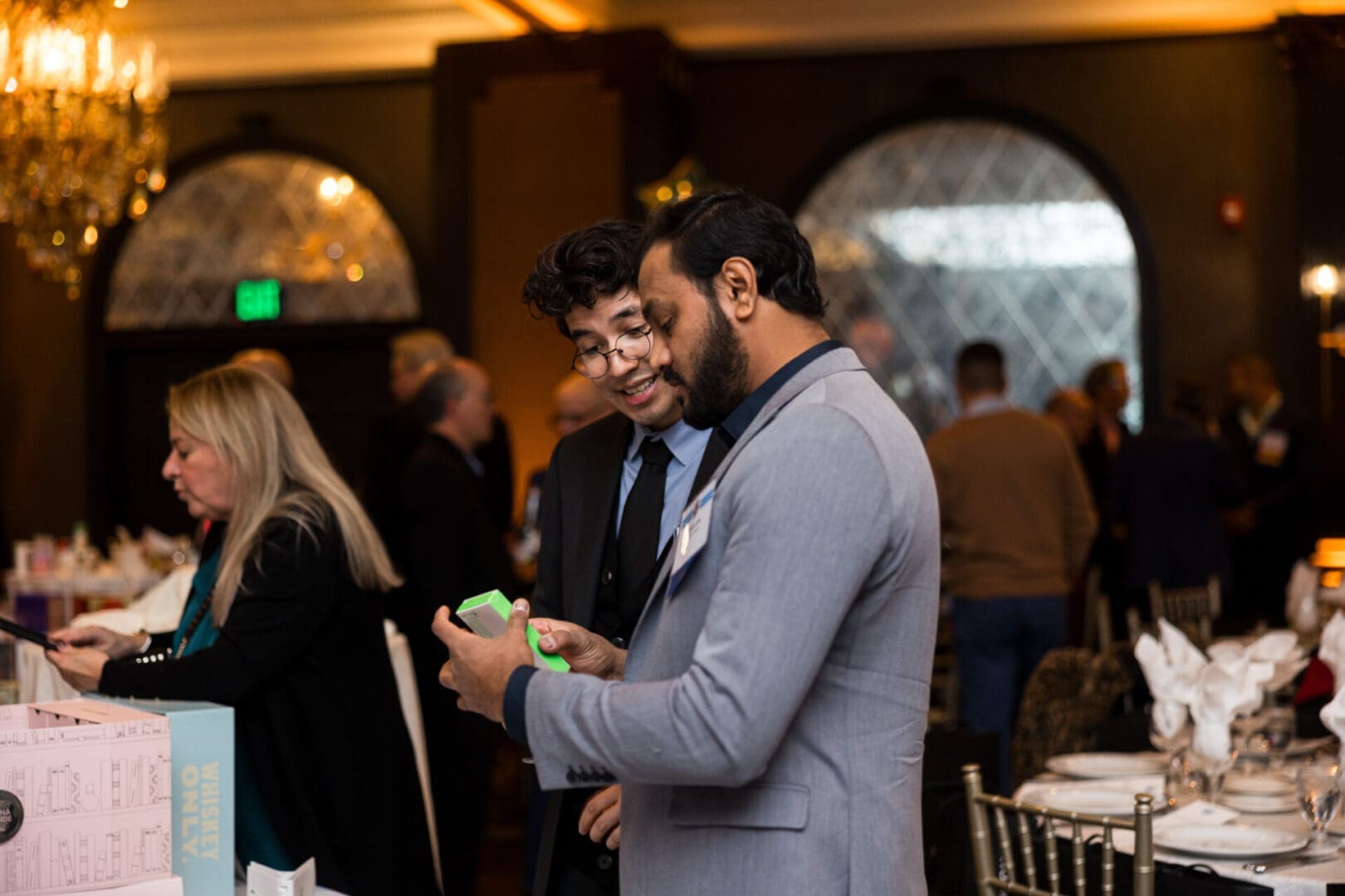 Two men conversing at a social event.