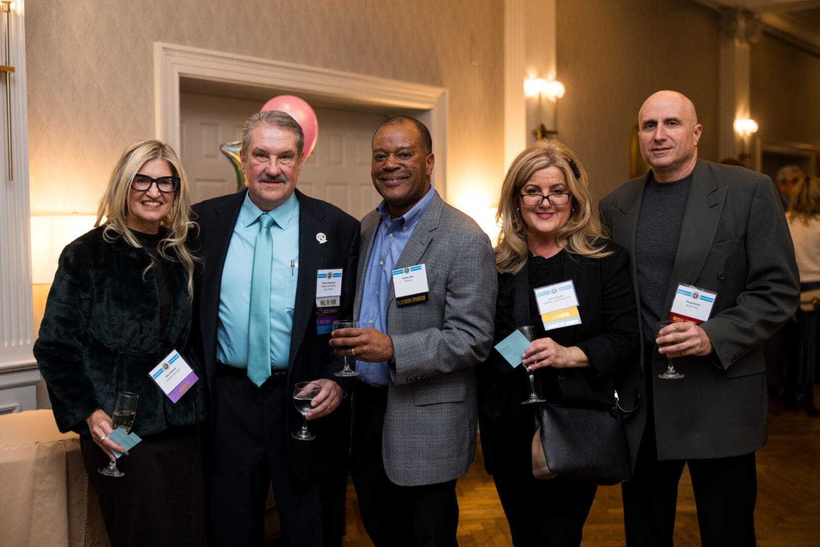 Group of people posing at an event.