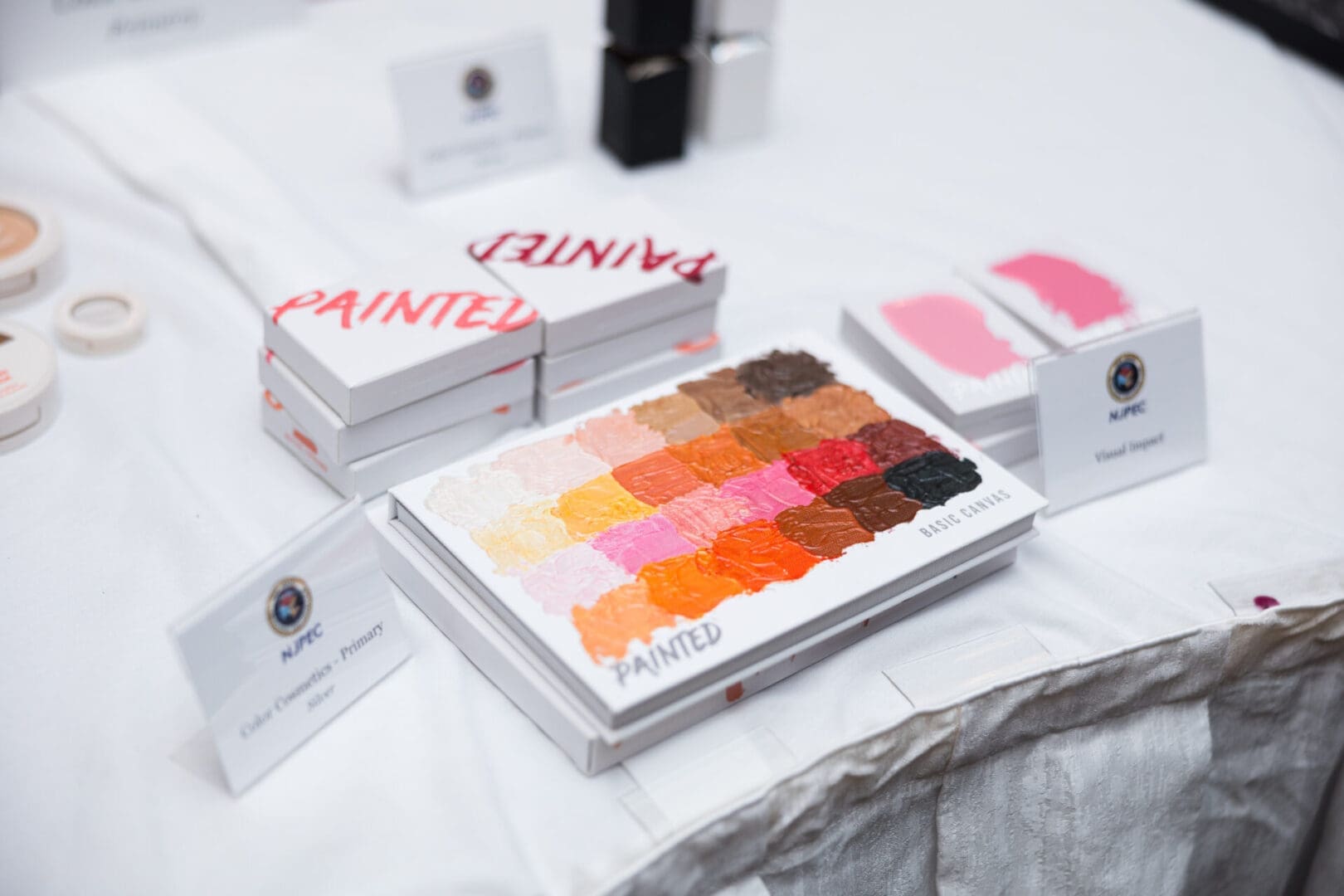 Palette of vibrant colors and makeup items.