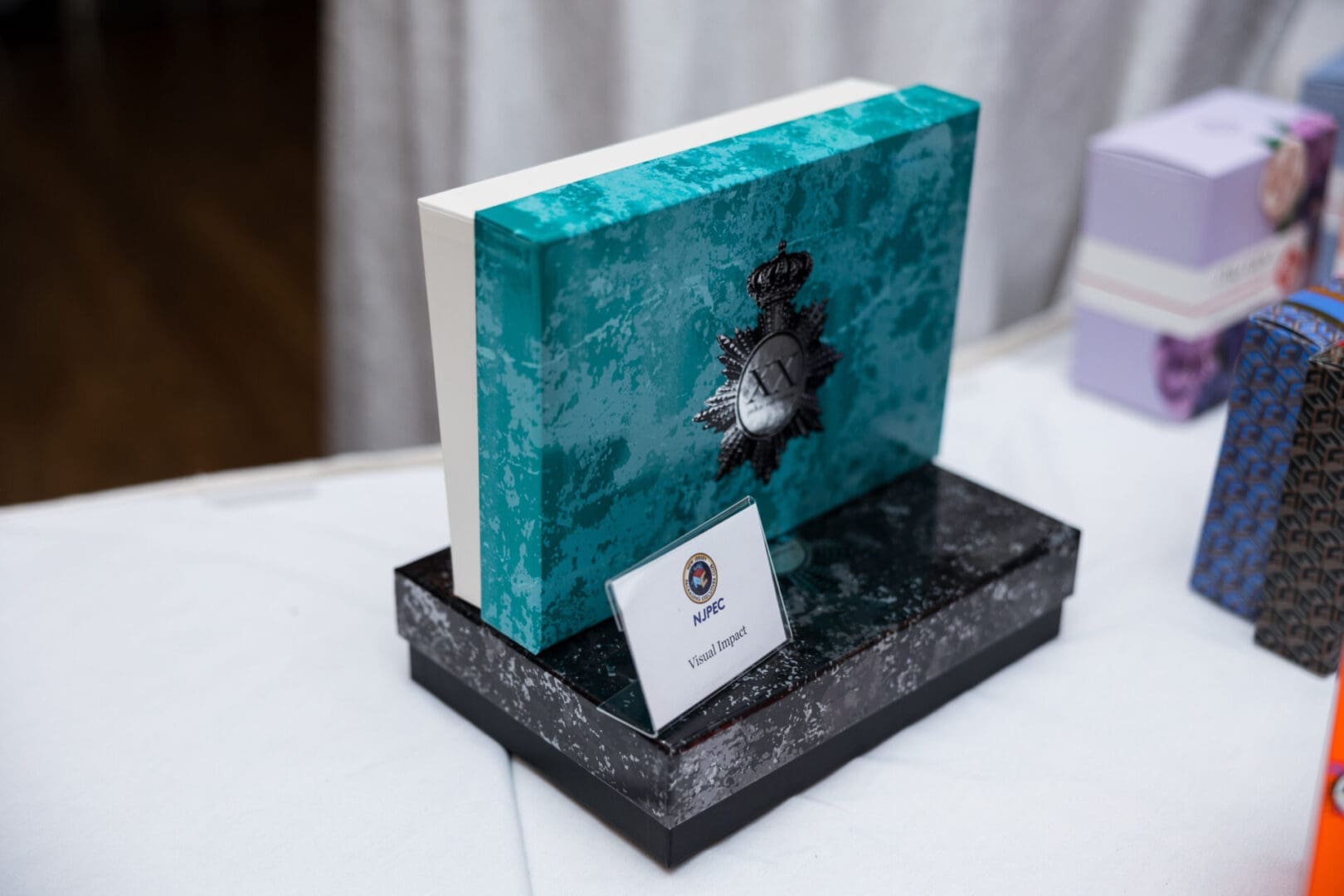 Decorative book award on display table.
