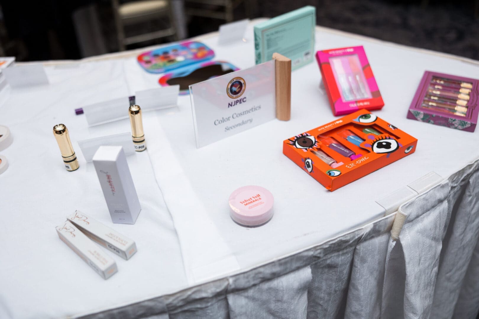 Color cosmetics displayed on a table.