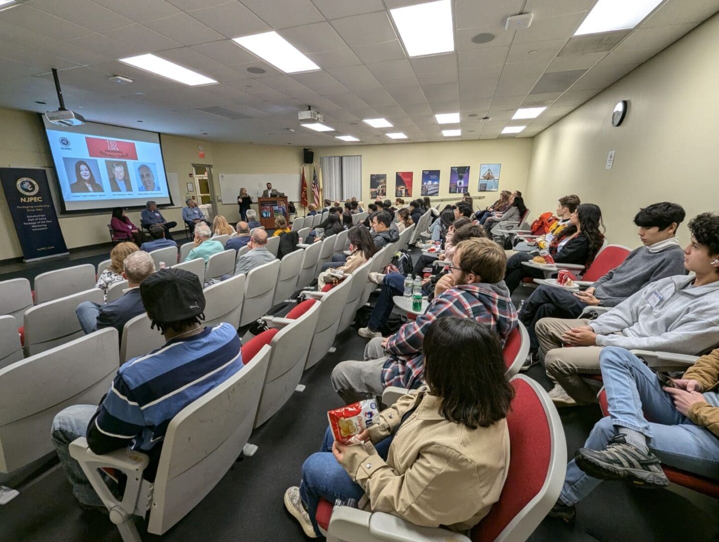 Audience attending a presentation in a seminar.