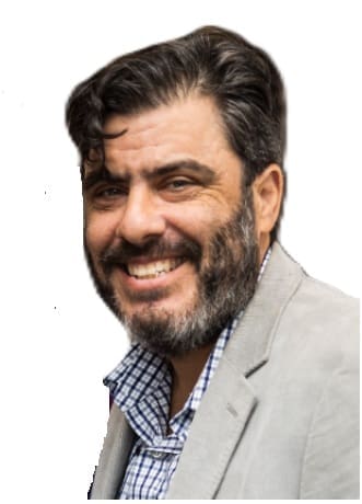 Smiling man with a beard and jacket.